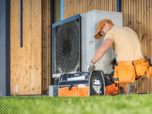 Professional inspecting exterior HVAC condenser unit during home inspection in San Antonio Texas