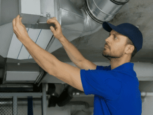 Home inspector checking HVAC system during pre-listing inspection in San Antonio